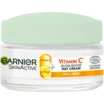 Un pot de Garnier Skin Active Bio Glow à la Vitamine C Crème de Jour Hydratante Éclat Et Uniformité 50 ml pour peau terne avec un couvercle vert et un graphisme d'agrumes sur l'étiquette, disponible à un prix abordable à Dakar, au Sénégal.