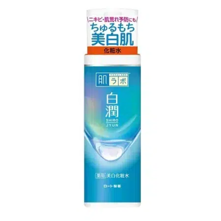 Produit de soin japonais dans un flacon bleu avec un bouchon blanc et du texte, étiqueté « Rohto Hada Labo Shirojun Lotion Arbutin Éclaircissant Anti-Taches 170 ml. dakar, Sénégal