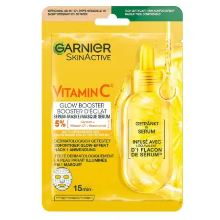 Un Garnier Masque en Tissu Booster Eclat Vitamine C 1 pièce, dans un emballage jaune vif avec texte d'information sur le produit.