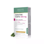 Boîte de Biocyte Kératine Forte Anti-Chute 500 mg d'Univers Cosmetix, accompagnée de deux gélules vertes à côté, gage de qualité.