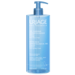 Un flacon bleu de Uriage Gel Douche Surgras Dermatologique Peaux Sensibles 500 ml avec une pompe, étiqueté pour les soins de la peau sensible, 17,6 fl oz (500 ml).