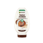 Garnier Ultra Doux Après-Shampooing Nourrissant Lait de Coco et Macadamia Flacon de 250 ml avec texte Kokos Milch & Macadamia et étiquette d'ingrédients 97% naturels, disponible chez Univers Cosmetix à Dakar, Sénégal.