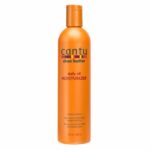Un flacon orange de CANTU - Lait capillaire au Beurre de Karité (Hydratant quotidien à l'huile) 384 ml d'Univers Cosmetix, avec un texte détaillant les bienfaits et l'utilisation du produit. De qualité provenant de Dakar, il promet de garder vos cheveux hydratés et sains.