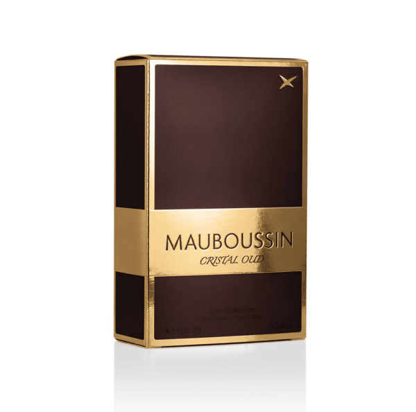 Un coffret marron et or de MAUBOUSSIN Cristal Oud L’Eau de Parfum 100 ml, parfait pour ceux qui recherchent le luxe au Sénégal sans se ruiner (pas cher).