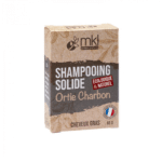 Une boîte de MKL Shampooing solide Orties Charbon - 65 g, labellisée « Écologique & Naturel », disponible en exclusivité chez Univers Cosmetix à Dakar, incarne l'essence de la qualité.