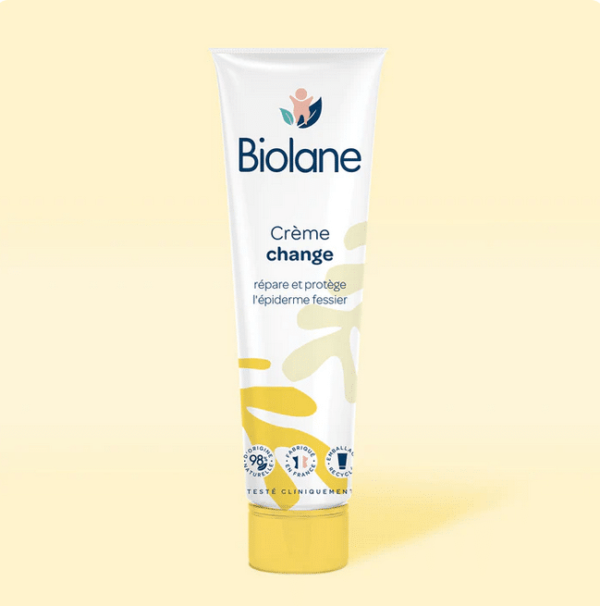 Biolane Crème change Bébé Tube 100 ml sur fond jaune, avec texte indiquant qu'elle répare et protège la peau ; 98% d'origine naturelle. Disponible pas cher à Dakar et dans tout le Sénégal.