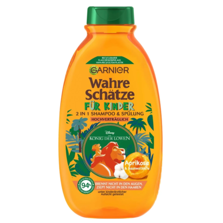 Flacon orange de GARNIER Ultra Doux Enfants Shampoing et Après-Shampooing 2 en 1 pour enfants, à l'effigie du Roi Lion, parfumé à l'abricot et à la fleur de coton. 600 ml.