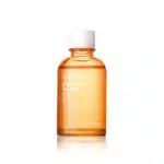 Un flacon orange de Jumiso All Day Vitamin Glow Boost Tonique pour le Visage 125 ml avec un bouchon blanc repose sur un fond blanc, rayonnant la promesse d'une peau plus lumineuse. dakar, Sénégal