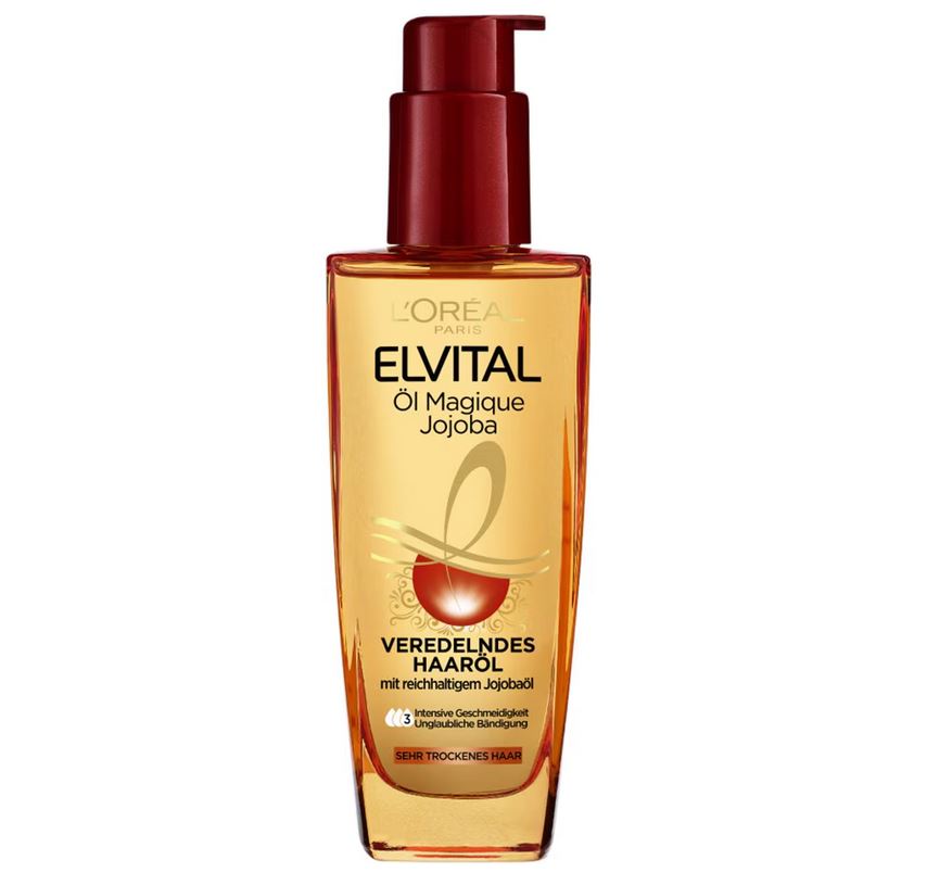 Un flacon d'Huile extraordinaire au jojoba Elvital de L'Oréal Paris de 100 ml, doté d'un élégant distributeur à pompe rouge et d'un liquide jaune-or qui ne manquera pas de nourrir vos cheveux. dakar, Sénégal