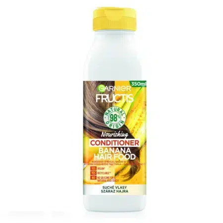 Un flacon de Garnier Fructis Banana Hair Food Après Shampooing Nourrissant Cheveux Secs, 350 ml, avec un bouchon jaune et une étiquette vibrante.