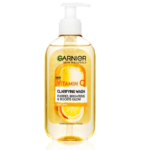 Flacon de Garnier Skin Naturals Vitamine C Gel Nettoyant Illuminateur Visage 200 ml, contenant visiblement des tranches d'orange, parfaites pour rajeunir les peaux ternes.