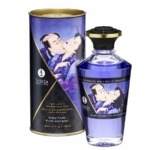 Flacon de Shunga Peinture de Corps Comestible Chocolat Aphrodisiaque 100 ml avec une boîte cylindrique présentant l'illustration traditionnelle Shunga Peinture d'un couple enlacé.