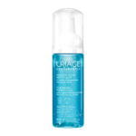 Un flacon bleu d'URIAGE MOUSSE D'EAU NETTOYANTE 150ml avec une pompe blanche, enrichie en extrait d'edelweiss bio.