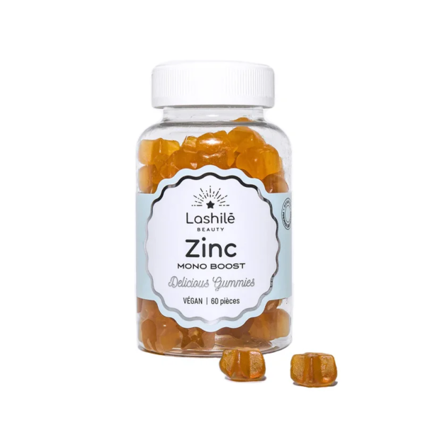 Un flacon de LASHILE BEAUTY Zinc Un essentiel pour l'organisme, étiqueté « 60 pièces », sert de complément vital sous forme d'oursons gélifiés à l'orange végétaliens.