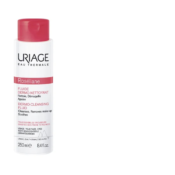 Flacon de URIAGE Roseliane Fluide Dermo Nettoyant 250 ml au bouchon rose et texte en français et anglais, idéal pour les soins des peaux sensibles. Le URIAGE Roseliane Fluide Dermo Nettoyant est parfait pour les routines de nettoyage en douceur.