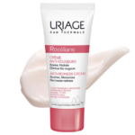 Tube de URIAGE Roseliane Crème Anti Rougeurs 40 ml sur fond blanc avec un tourbillon de crème à côté.