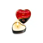 Bougie de massage en forme de coeur avec flamme allumée, accompagnée de son emballage rouge et noir étiqueté "Plaisir Secret Bougie de Massage Chocolat 35 ml. dakar, Sénégal