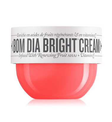 Un contenant rouge de Sol de Janeiro Bom Dia Bright Cream crème pour le corps éclat 75 ml avec une étiquette blanche