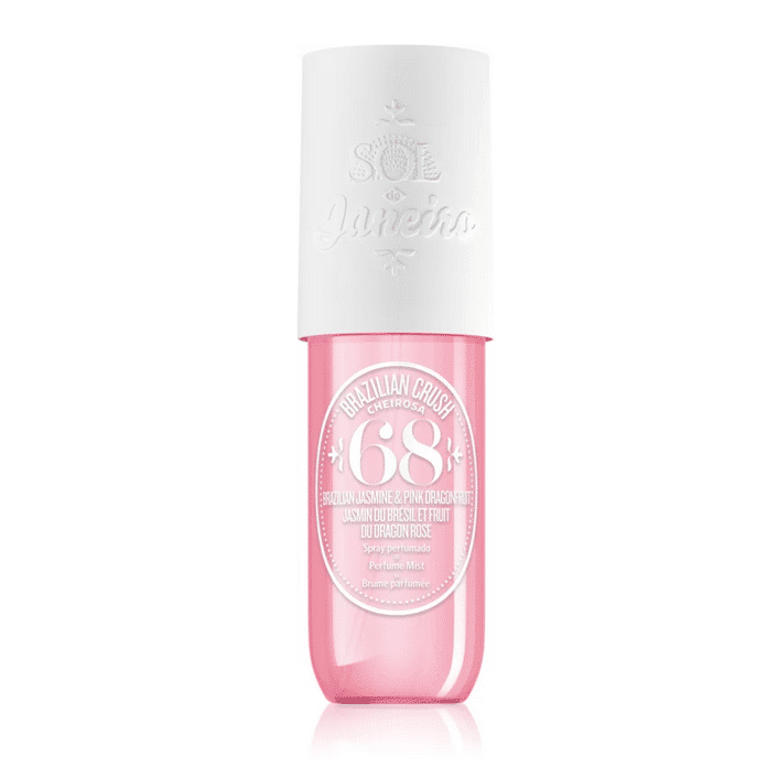 Un flacon cylindrique rose de Sol de Janeiro Brazil Crush Cheirosa '68 Brume Parfumée Corps et Cheveux pour femme 90 ml avec un bouchon blanc