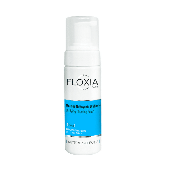 Un flacon de Floxia Mousse Nettoyante Unifiante – 150 ml avec un bouchon blanc et une étiquette bleue