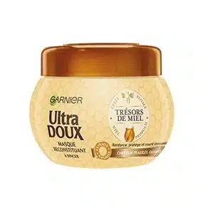 Un pot de Garnier Masque Reconstituant Trésors de Miel - Ultra Doux 300 ml est parfait pour les cheveux fragiles et abîmés. dakar