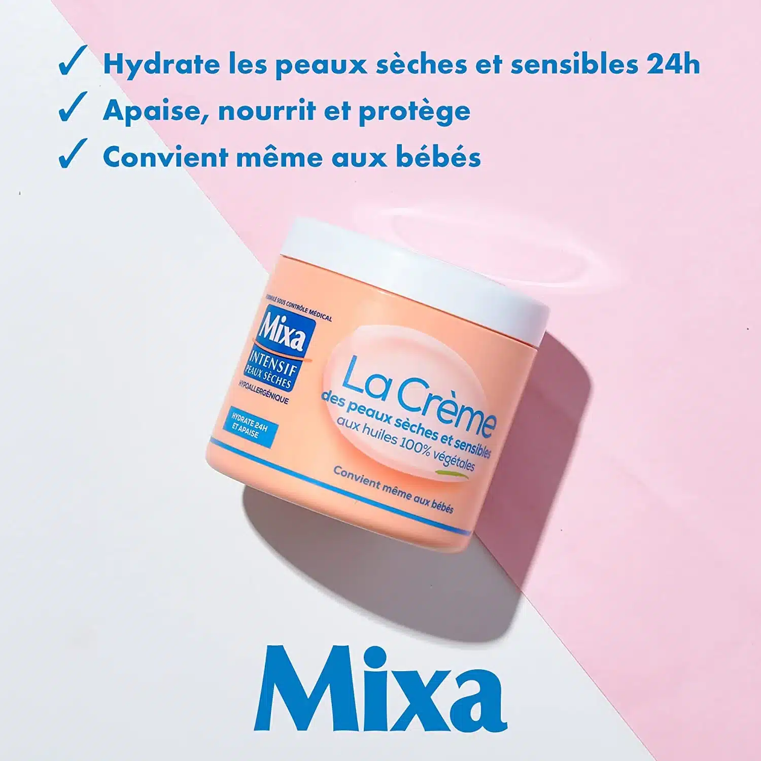 Un pot de 400 ml de MIXA La Crème des Peaux Sèches et Sensibles Multi Usage Visage sur fond rose