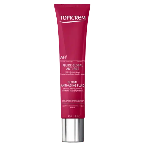 Un tube rouge de Topicrem AH3 Fluide Global Eclat Anti-Âge 40 ml avec un capuchon argenté