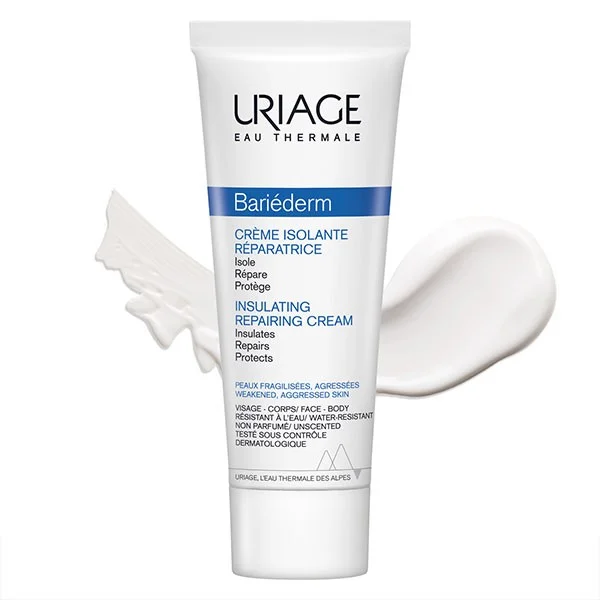 Tube blanc étiqueté "Uriage Bariederm Crème Isolante Réparatrice Peaux Agressées et Irritées Sans parfum 75 ml" avec quelques traces de crème en arrière-plan. dakar