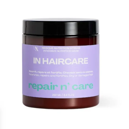 Un pot de 250 ml de InHairCare Masque Intense Repair n' Care Nourrit Repare Fortifie conçu pour les cheveux secs ou abîmés, doté d'une étiquette violette avec un texte blanc et vert mettant l'accent sur « repair n' care », et logé dans un récipient marron avec un couvercle noir. Dakar