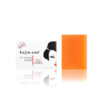 Boîte et pain de savon orange. La boîte présente une illustration de profil représentant une femme et le texte « savon éclaircissant pour la peau Kojie•san ». Le savon est décrit comme « lumière sans pigment » et « classique ». Dakar