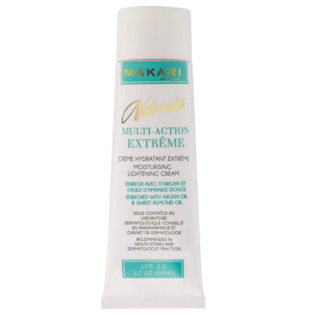 Un tube blanc portant l'inscription « Makari Naturalle Multi-Action Extrême » crème hydratante éclaircissante. Il contient de l'huile d'argan et d'amande douce, un FPS 15 et un format de 50 ml. L'emballage est principalement blanc avec des touches dorées et vertes. Dakar